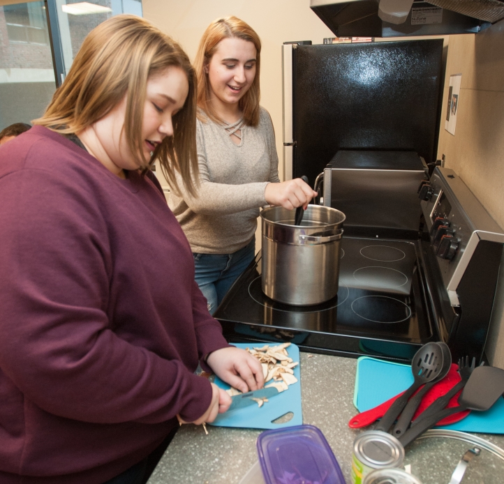 Residents cooking in Bishop Hall kitchen