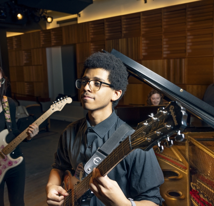Student playing guitar