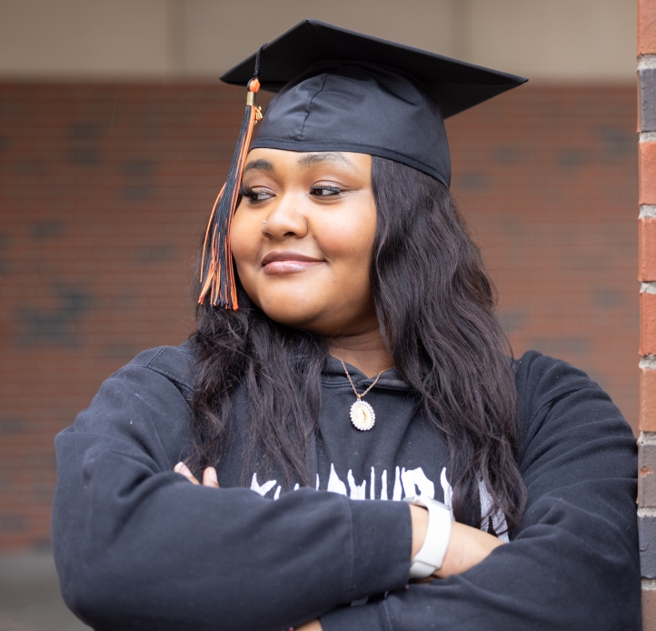 Student posing in graduation cap