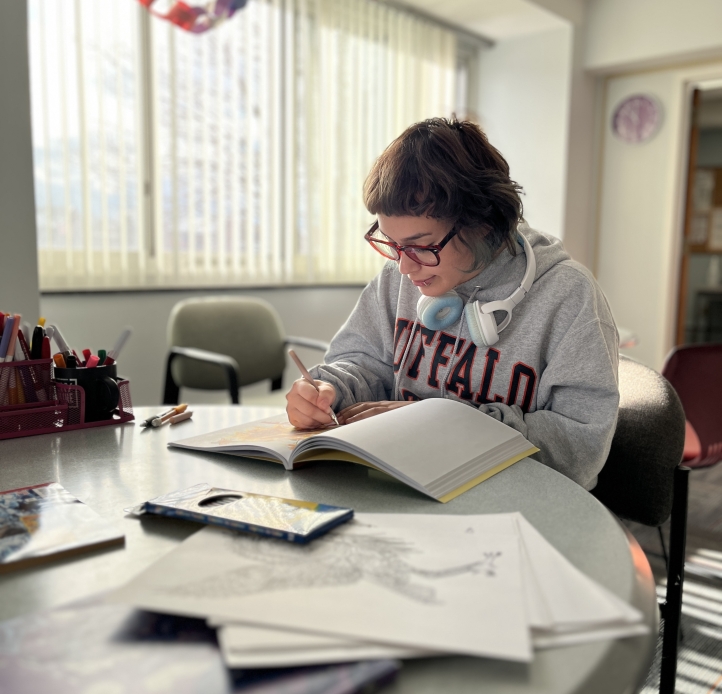 Student studying in the Honors Hub lounge