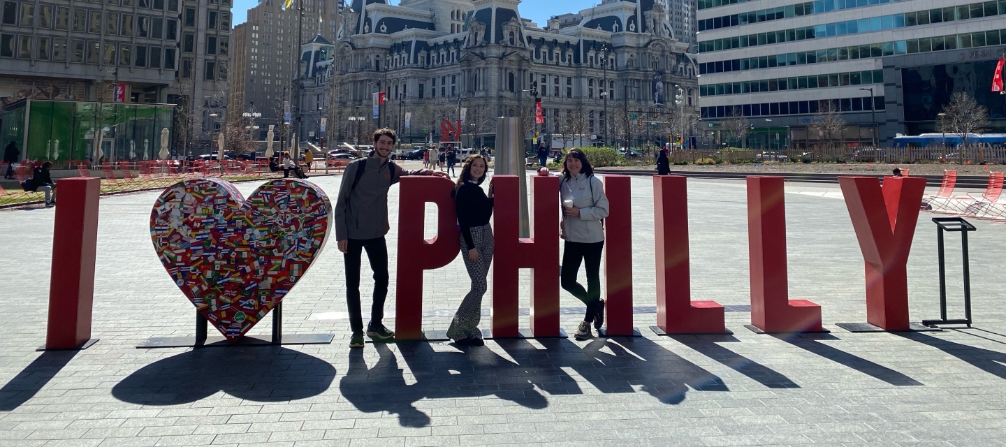 Honor student and staff posing with "I Heart Philly" sculpture in Philadelphia.
